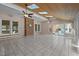 Sunroom featuring tile floors, wood ceiling with skylights, brick accent wall, and glass doors to the backyard at 6336 Wrenwood Ave, Raleigh, NC 27607