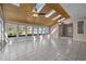 Bright sunroom with tile floors, wood-paneled ceiling, skylights, and multiple windows overlooking the outdoors at 6336 Wrenwood Ave, Raleigh, NC 27607