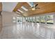Bright sunroom featuring skylights, ceiling fans, and large windows offering panoramic views, perfect for relaxation at 6336 Wrenwood Ave, Raleigh, NC 27607