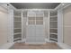 Well-organized walk-in closet featuring built-in shelving and drawers, maximizing storage and convenience at 6336 Wrenwood Ave, Raleigh, NC 27607