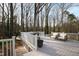 Spacious deck with modern furniture and wooded views for outdoor living at 6713 Brookhollow Dr, Raleigh, NC 27615