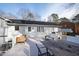 Spacious back deck ideal for outdoor entertaining, featuring a dining area and comfortable seating at 6713 Brookhollow Dr, Raleigh, NC 27615