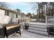 Multi-level deck with outdoor seating and grilling area, perfect for enjoying the backyard at 6713 Brookhollow Dr, Raleigh, NC 27615