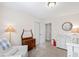Neutral toned Bedroom with an antique dresser, modern changing table, and natural light at 6713 Brookhollow Dr, Raleigh, NC 27615