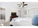 Bedroom with a ceiling fan, dresser, and closet doors at 6713 Brookhollow Dr, Raleigh, NC 27615