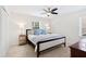 Bedroom featuring a ceiling fan and a large bed at 6713 Brookhollow Dr, Raleigh, NC 27615