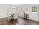 Bright dining room with hardwood floors and elegant chandelier at 6713 Brookhollow Dr, Raleigh, NC 27615