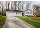 Lovely home featuring a long driveway and a two-car garage at 6713 Brookhollow Dr, Raleigh, NC 27615
