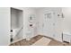 Entryway features neutral colors, decorative mirror, and wood floors at 6713 Brookhollow Dr, Raleigh, NC 27615