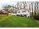 Inviting home with a lush green lawn and mature trees at 6713 Brookhollow Dr, Raleigh, NC 27615