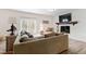 Cozy living room features a fireplace and comfortable seating at 6713 Brookhollow Dr, Raleigh, NC 27615
