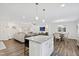 Open concept living with kitchen island, living room, and dining at 6713 Brookhollow Dr, Raleigh, NC 27615