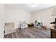 Bright playroom with dark LVP flooring, cube storage, and cozy modular couch at 6713 Brookhollow Dr, Raleigh, NC 27615