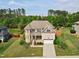 Beautiful home with well-maintained landscaping and a private backyard in a desirable community at 701 Prince Dr, Holly Springs, NC 27540