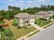 Residential home featuring a well-manicured lawn, mature trees, and a convenient two-car garage at 701 Prince Dr, Holly Springs, NC 27540
