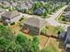 Aerial view showcasing the fenced backyard, wood deck, and the neighborhood at 701 Prince Dr, Holly Springs, NC 27540