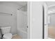 Well-lit bathroom including a shower/tub combo and a tiled floor at 701 Prince Dr, Holly Springs, NC 27540