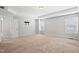 Bedroom featuring carpet, tray ceiling, and bright windows at 701 Prince Dr, Holly Springs, NC 27540