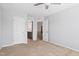Comfortable bedroom featuring neutral carpeting and attached bathroom entrances at 701 Prince Dr, Holly Springs, NC 27540