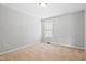 Bedroom with a window that brings in natural light, set against neutral colored walls at 701 Prince Dr, Holly Springs, NC 27540