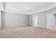 Bedroom boasts neutral carpet and a tray ceiling at 701 Prince Dr, Holly Springs, NC 27540