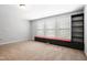 Bonus room with custom built-ins providing both seating and storage options at 701 Prince Dr, Holly Springs, NC 27540