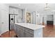 Bright, modern kitchen features a large island, stainless steel appliances, and lots of storage at 701 Prince Dr, Holly Springs, NC 27540