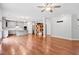 Spacious living area seamlessly connects to the kitchen with hardwood floors and recessed lighting at 701 Prince Dr, Holly Springs, NC 27540