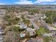Aerial view showcasing the property's in-ground pool, landscaped grounds, neighborhood, and surrounding mature trees at 705 Glen Eden Dr, Raleigh, NC 27612