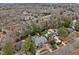 Overhead view highlighting the property with a pool and lush surroundings in a picturesque neighborhood at 705 Glen Eden Dr, Raleigh, NC 27612
