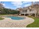 Large backyard with a pool, landscaping, and outdoor seating at 705 Glen Eden Dr, Raleigh, NC 27612