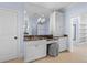 Bathroom featuring a vanity area with a granite countertop and built-in storage and cabinets at 705 Glen Eden Dr, Raleigh, NC 27612