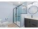 Bathroom features new glass shower, blue subway tile and modern vanity at 705 Glen Eden Dr, Raleigh, NC 27612