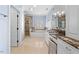 Spacious bathroom with a shower, tub, granite countertops, and vanity with built-in storage at 705 Glen Eden Dr, Raleigh, NC 27612
