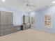 Light blue bedroom featuring carpet, two windows, and storage cabinets with drawers and a countertop at 705 Glen Eden Dr, Raleigh, NC 27612