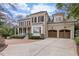 Beautiful brick home featuring a two-car garage and covered front porch at 705 Glen Eden Dr, Raleigh, NC 27612