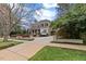 Charming two-story home with a welcoming front porch, manicured landscaping, and a spacious driveway at 705 Glen Eden Dr, Raleigh, NC 27612