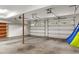 Two car garage with concrete floors, an insulated garage door, and shelving at 705 Glen Eden Dr, Raleigh, NC 27612