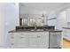 Stylish kitchen with granite countertops, stainless steel appliances, and a functional breakfast bar at 705 Glen Eden Dr, Raleigh, NC 27612