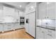 Modern kitchen features stainless steel appliances, white cabinets, and sleek countertops at 705 Glen Eden Dr, Raleigh, NC 27612