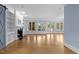 Bright living room featuring a fireplace, built-in bookshelves, and large windows at 705 Glen Eden Dr, Raleigh, NC 27612