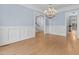 Bright, open space features hardwood floors, chair rail, and a chandelier at 705 Glen Eden Dr, Raleigh, NC 27612
