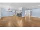 Open concept living room with beautiful hardwood floors and access to the kitchen area at 705 Glen Eden Dr, Raleigh, NC 27612