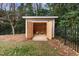 Backyard shed providing outdoor storage space with lawn equipment at 705 Glen Eden Dr, Raleigh, NC 27612