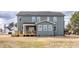 Rear exterior view of a two-story home featuring a deck and expansive yard at 72 Cultivator Ct, Angier, NC 27501