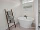 Elegant bathroom showcasing a freestanding tub, stylish fixtures, and bright natural light at 72 Cultivator Ct, Angier, NC 27501