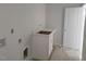 Neutral bathroom with vanity, door, and natural light at 72 Cultivator Ct, Angier, NC 27501