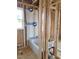 Bathroom framing with a tub installed near a window; construction phase with a view and natural lighting at 72 Cultivator Ct, Angier, NC 27501