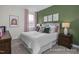 Cozy bedroom with a comfortable bed, soft lighting, and decorative wall art at 72 Cultivator Ct, Angier, NC 27501