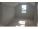 Bright bedroom with window, neutral walls, and flooring at 72 Cultivator Ct, Angier, NC 27501